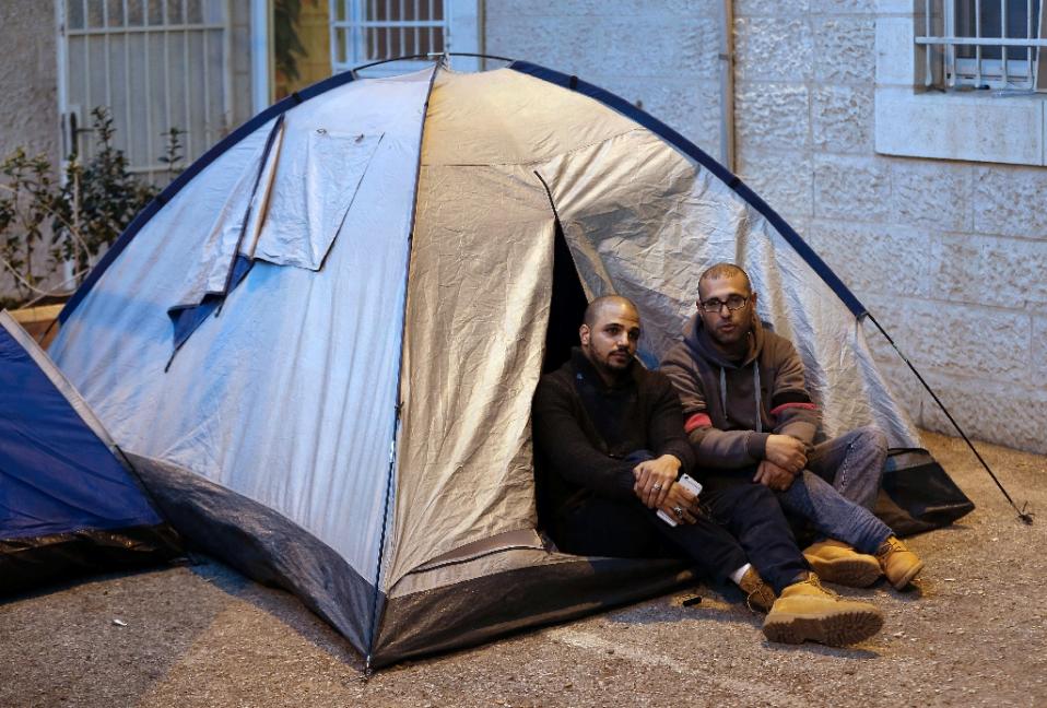 samer abu eisheh l and hijazi abu sbeih palestinians from jerusalem installed tents at the international committee of the red cross icrc in the city defying a military order banning them from entering their hometown for months photo afp