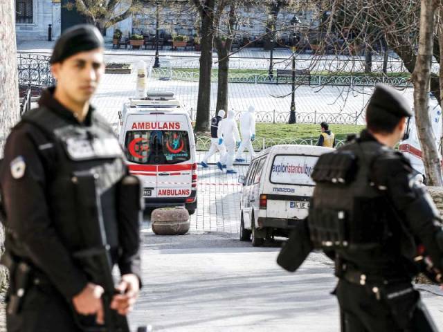 turkish policemen block access to the blue mosque after the blast photo afp