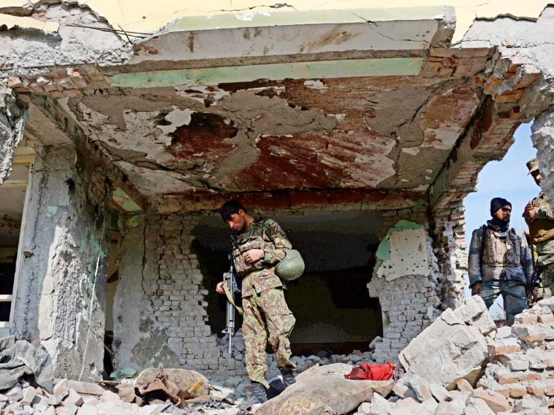 security personnel inspect a building used by insurgents to launch the attack photo afp