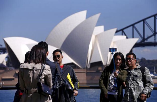 file picture of chinese tourists taking pictures of themselves as they pose in front of the sydney opera house in sydney australia september 28 2015 photo reuters