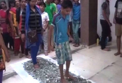 indian students walk barefoot on broken glass