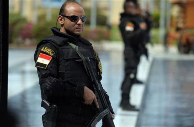 egyptian police standing guard photo afp file egyptian police standing guard photo afp file