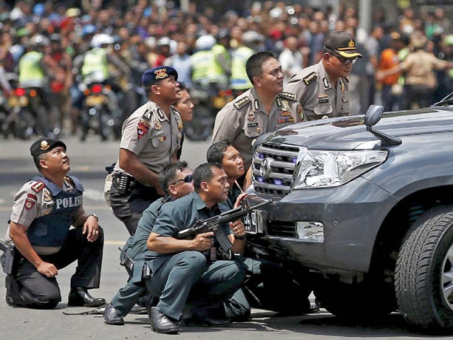 police officers react near the blast site in jakarta photo reuters police officers react near the blast site in jakarta photo reuters