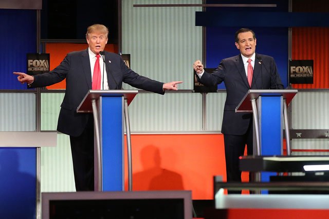 republican presidential candidates l donald trump and sen ted cruz r participate in the fox business network republican presidential debate at the north charleston coliseum and performing arts center on january 14 2016 in north charleston south carolina photo afp