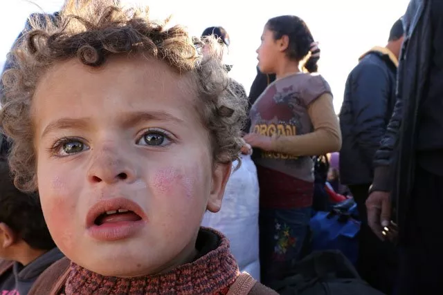 syrian refugees stuck between the jordanian and syrian borders wait to cross into jordan near the town of ruwaished east of the jordanian capital amman january 14 2016 photo afp syrian refugees stuck between the jordanian and syrian borders wait to cross into jordan near the town of ruwaished east of the jordanian capital amman january 14 2016 photo afp