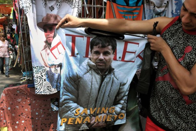 a vendor shows a t shirt with the face of joaquin quot el chapo quot guzman loera for sale in the popular and dangerous tepito neighborhood in mexico city on july 20 2015 photo afp a vendor shows a t shirt with the face of joaquin quot el chapo quot guzman loera for sale in the popular and dangerous tepito neighborhood in mexico city on july 20 2015 photo afp