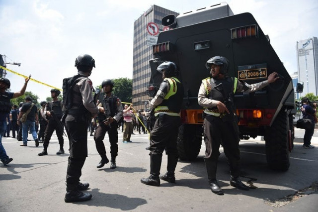 indonesian armed police clear the area near a starbucks after a series of blasts hit jakarta on january 14 2016 photo afp indonesian armed police clear the area near a starbucks after a series of blasts hit jakarta on january 14 2016 photo afp
