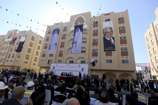posters depicting palestinian president mahmoud abbas r qatar 039 s former emir sheikh hamad bin khalifa al thani c and emir of qatar tamim bin hamad al thani are seen on a building as people attend the opening ceremony of qatari funded construction project quot hamad city quot in khan younis in the southern gaza strip january 16 2016 photo reuters posters depicting palestinian president mahmoud abbas r qatar 039 s former emir sheikh hamad bin khalifa al thani c and emir of qatar tamim bin hamad al thani are seen on a building as people attend the opening ceremony of qatari funded construction project quot hamad city quot in khan younis in the southern gaza strip january 16 2016 photo reuters