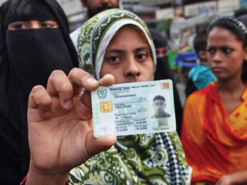 a girl shows the computerised national identity card of a young man who was killed allegedly in an encounter in korangi industrial area in november last year the family protested outside karachi press club insisting that he was innocent photo file