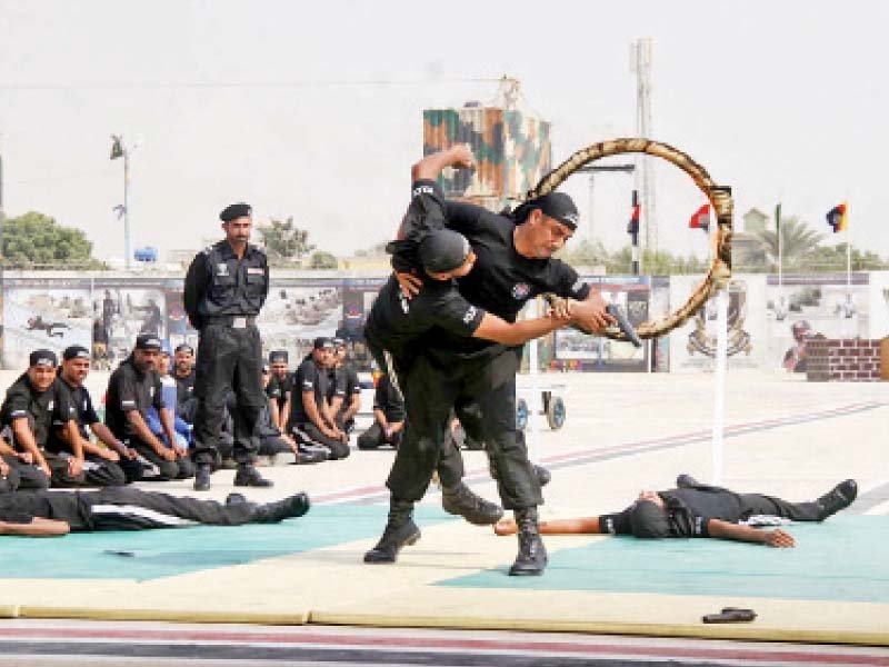 police commandoes display their skills at the 28th passing out parade of eaglet course at shaheed benazir bhutto elite police training centre in razzakabad on saturday photo online