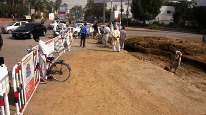traffic resumes 50 work on broken part of shaheed e millat road completed