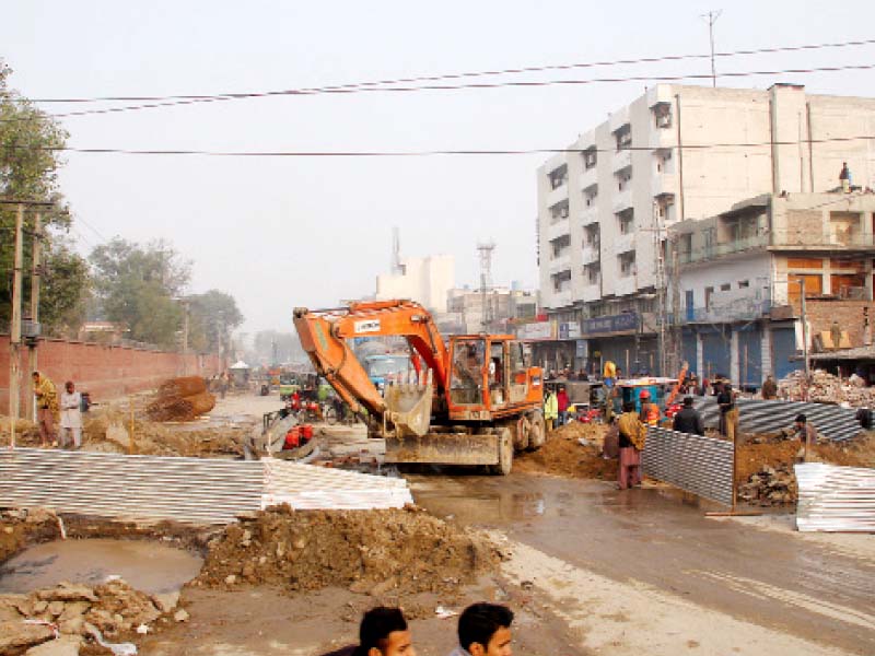 construction work for orange line track is underway at boharwala chowk near city railway station photo abid nawaz express