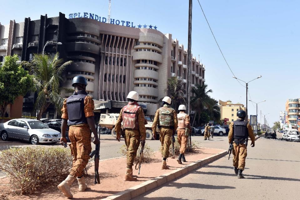 burkina faso troops patrol outside the splendid hotel and nearby cappuccino restaurant following a jihadist attack in ouagadougou on january 16 2016 photo afp