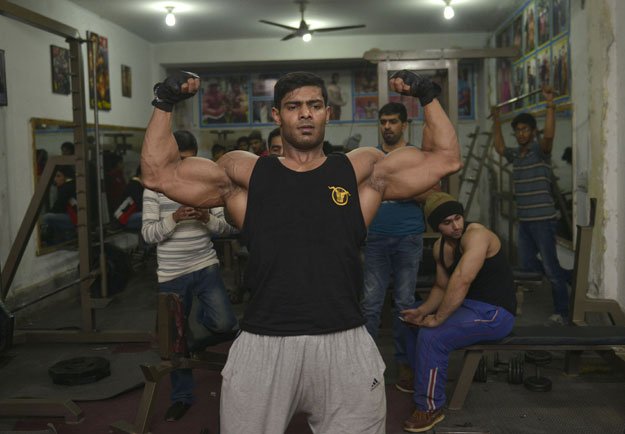 in this photograph taken on january 9 2016 pakistani body builder salman ahmed poses for a photograph at his gym in lahore photo afp