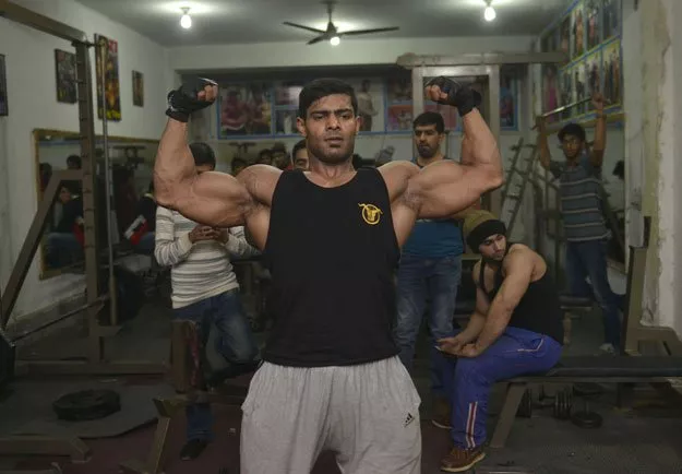 in this photograph taken on january 9 2016 pakistani body builder salman ahmed poses for a photograph at his gym in lahore photo afp in this photograph taken on january 9 2016 pakistani body builder salman ahmed poses for a photograph at his gym in lahore photo afp