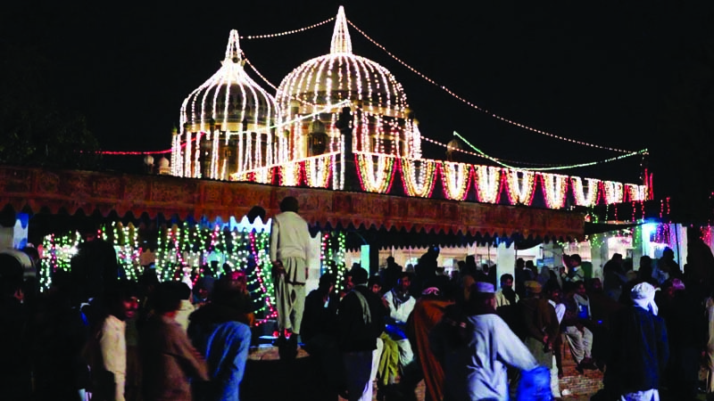 devotees at the shrine top left children performing jhoomar top right laying the wreath above photo express