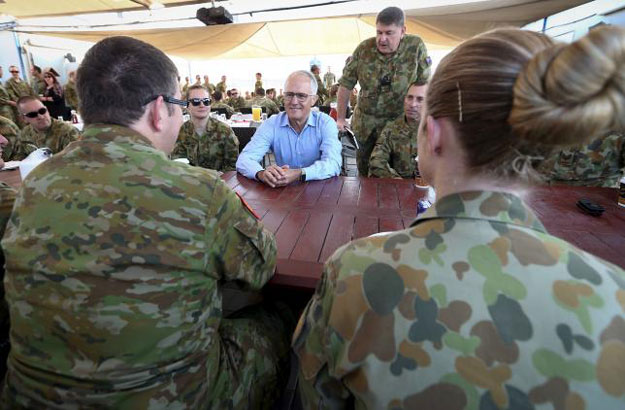 australian prime minister malcolm turnbull c talks with australian troops during breakfast at camp baird located in the middle east during his visit to iraq january 16 2016 photo reuters