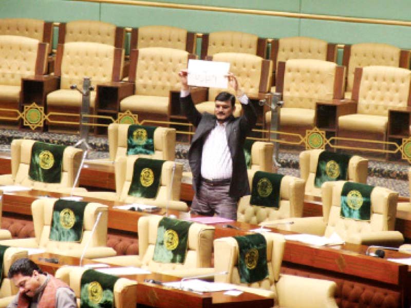 a lawmaker from the mqm protests by holding a placard that says give us powers during monday s session photo online