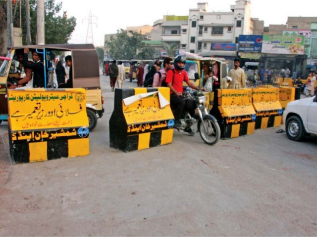 the main road leading to the institute of business management was blocked on monday to make way for construction work on the korangi crossing flyover photo athar khan express the main road leading to the institute of business management was blocked on monday to make way for construction work on the korangi crossing flyover photo athar khan express