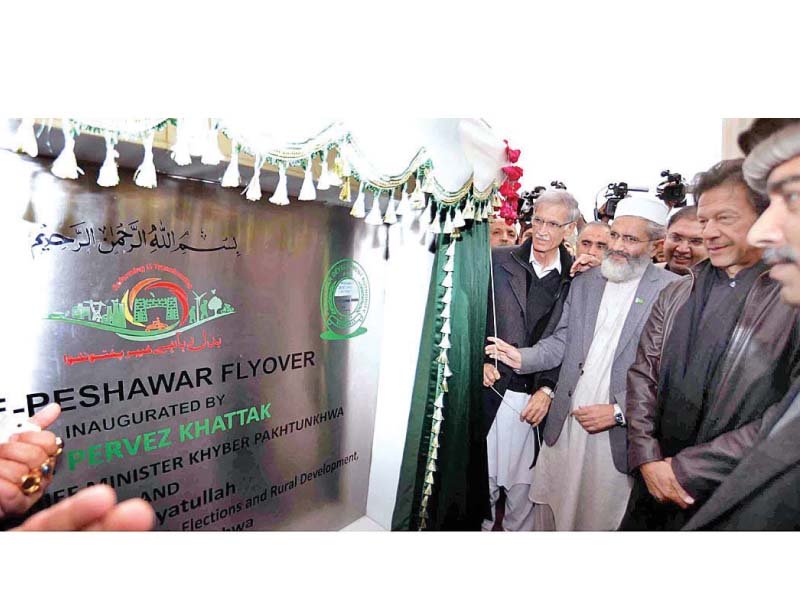pti chief imran khan ji ameer sirajul haq witness the inauguration of the bab e peshawar flyover by the k p cm pervez khatak photo inp