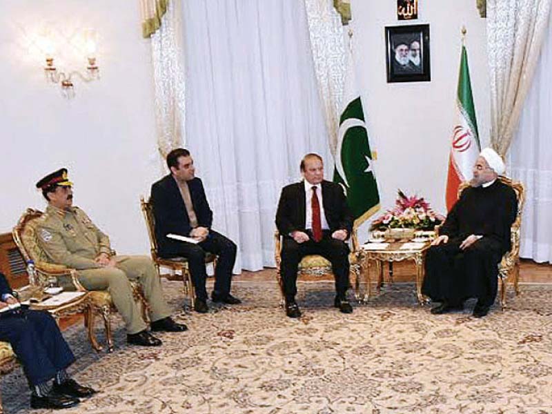 iran president hassan rowhani talks with pm nawaz and army chief gen raheel photo inp