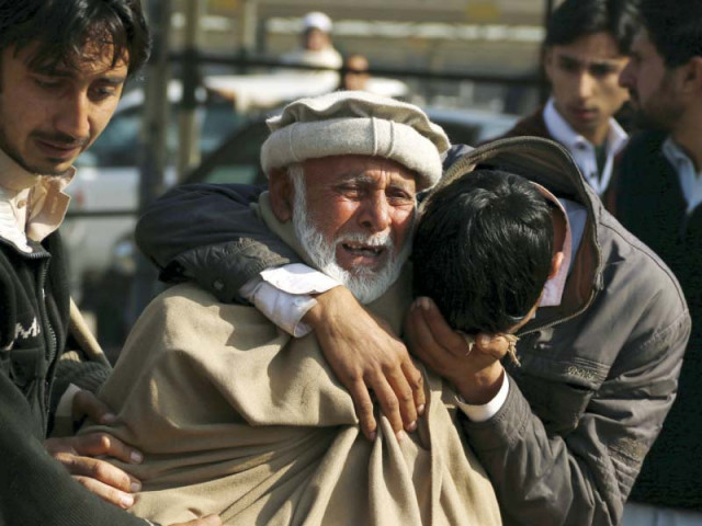 relatives grieve their loss at the hayatabad medical complex in peshawar photo reuters relatives grieve their loss at the hayatabad medical complex in peshawar photo reuters