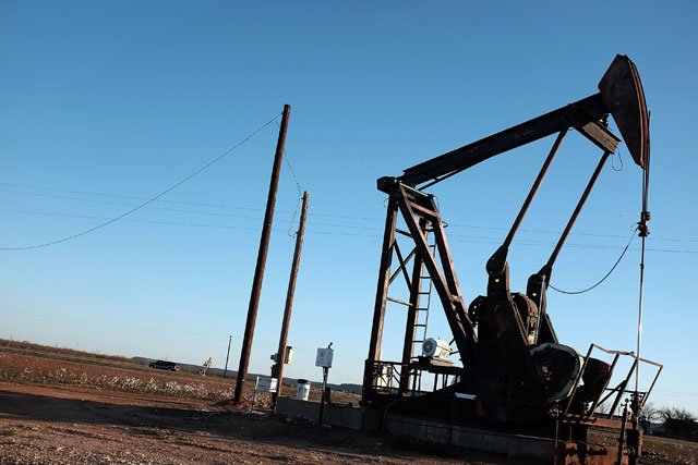 an oil pumpjack works on january 19 2016 in sweetwater texas global oil prices continue their downward fall with u s oil dropping towards 27 a barrel its lowest since 2003 on worries about global oversupply photo afp