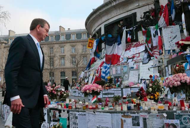 us secretary of defense ashton carter l pays tribute to the victims of paris terror attacks at the place de la republique republic square in paris on january 20 2016 photo afp