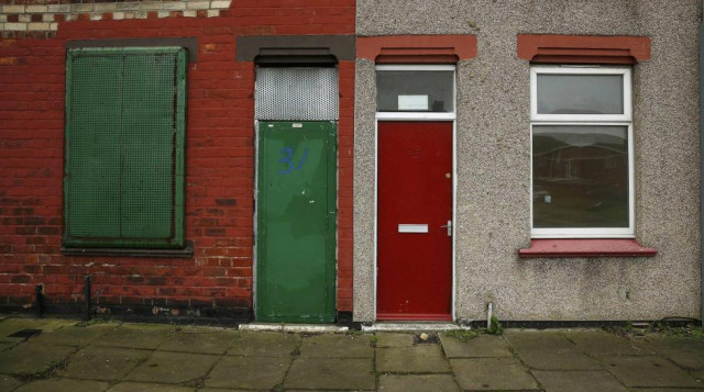 a painted red door of a house is seen on a terraced street in the gresham area of middlesbrough northern britain january 20 2016 photo reuters a painted red door of a house is seen on a terraced street in the gresham area of middlesbrough northern britain january 20 2016 photo reuters