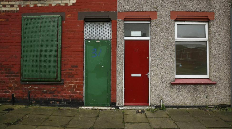 a painted red door of a house is seen on a terraced street in the gresham area of middlesbrough northern britain january 20 2016 photo reuters