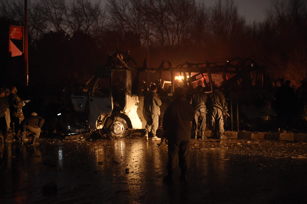 afghan security personnel inspect the damaged vehicle carrying employees of popular afghan tv channel tolo in kabul on january 20 2016 photo afp
