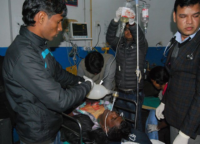 nepalese doctors treat a protestor who was injured during a demonstration in biratnagar southeast of kathmandu on january 21 2016 photo afp