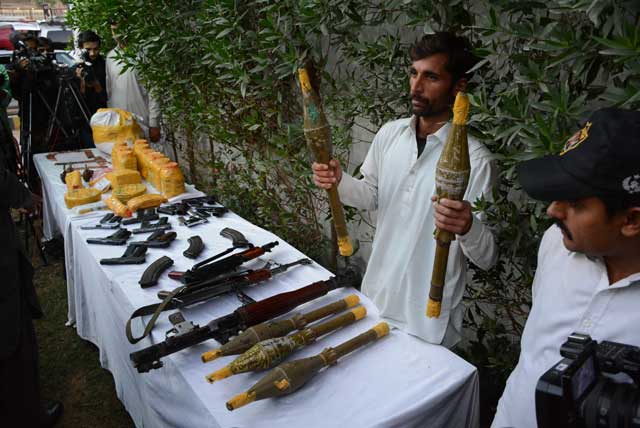 police officials show the weapons recovered from terrorists of al qaeda and lej on january 21 2016 photo mohammad noman express