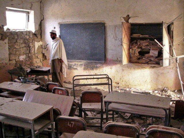 a man stands amid the debris of a bombed school in landikotal khyber agency photo file