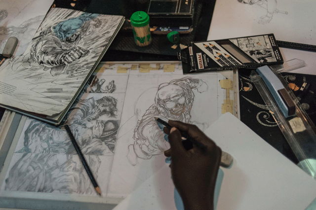 an illustrator works on a sketch at the comic republic office in lagos on january 8 2016 comic republic is one of a handful of comic startups founded by jide martins in nigeria making african superheroes for stories set in africa photo afp