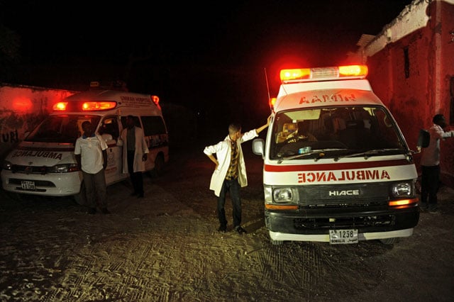 two ambulances stand on the scene of a bomb attack on january 21 2016 at lido beach in mogadishu photo afp