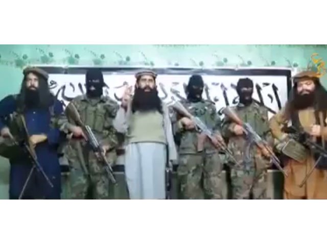 this still image taken from a video released by a faction within the pakistani taliban on january 22 2016 shows their leader khalifa umar mansoor c with militants delivering a statement from an undisclosed location