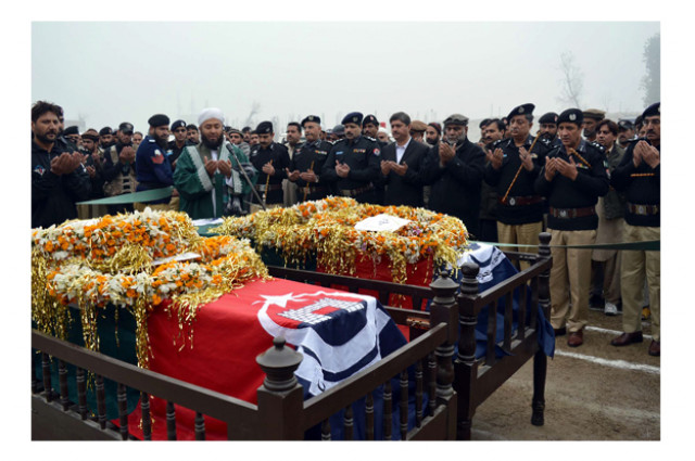 police personnel are offering funeral prayer of martyred police officials photo ppi police personnel are offering funeral prayer of martyred police officials photo ppi
