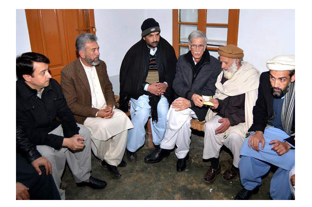 khyber pakhtunkhwa k p chief minister pervaiz khattak handing over cheque of rs 15 4 million to the father of the martyred professor late hamid hussain photo express