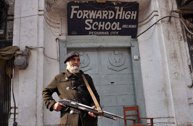 a pakistani policeman stood guard outside a school in peshawar the day after the taliban attacked bacha khan university photo afp