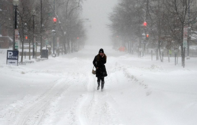 a woman walks on g street in washington on january 23 2016 photo afp a woman walks on g street in washington on january 23 2016 photo afp