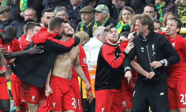 adam lallana celebrates scoring late winning goal with teammates and manager jurgen klopp at carrow road in norwich england on january 23 2016 photo afp adam lallana celebrates scoring late winning goal with teammates and manager jurgen klopp at carrow road in norwich england on january 23 2016 photo afp