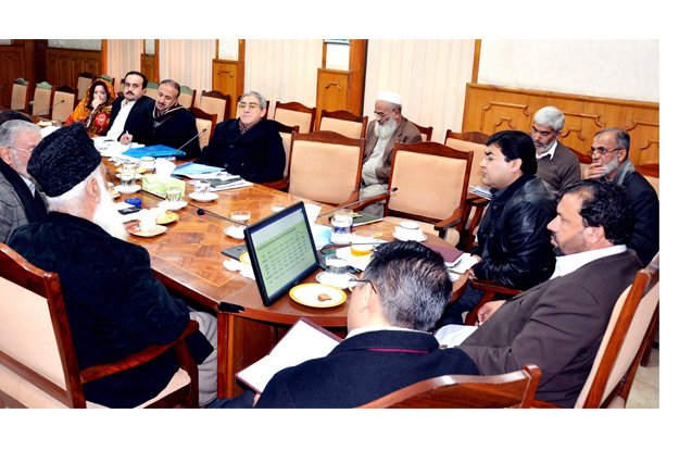 k p finance minister muzaffar chairing a meeting to discuss the nfc award photo express
