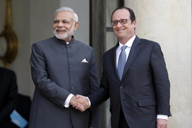 indian prime minister narendra modi l is greeted by french president francois hollande r photo reuters