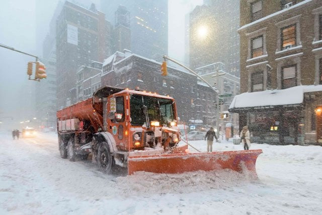 a snowplow clears snow on lexington avenue during the snowstorm on january 2016 in new york photo afp a snowplow clears snow on lexington avenue during the snowstorm on january 2016 in new york photo afp