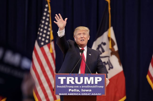 republican presidential candidate donald trump greets guests before speaking at a campaign event on january 23 2016 in pella iowa photo afp