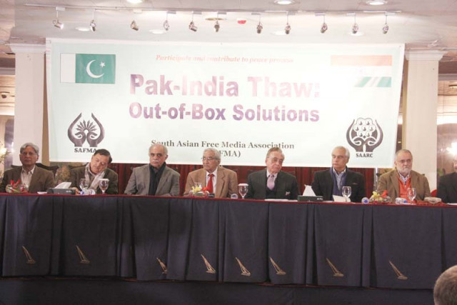 senator aitezaz ahsan left listens to participants of the conference right photos ayesha mir express