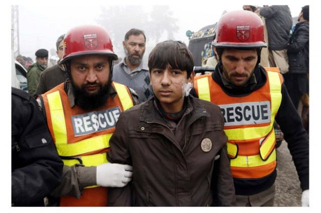 rescue officials busy in rescue operation at the site after remote control bomb explosion at chamkani vegetable market photo ppi rescue officials busy in rescue operation at the site after remote control bomb explosion at chamkani vegetable market photo ppi