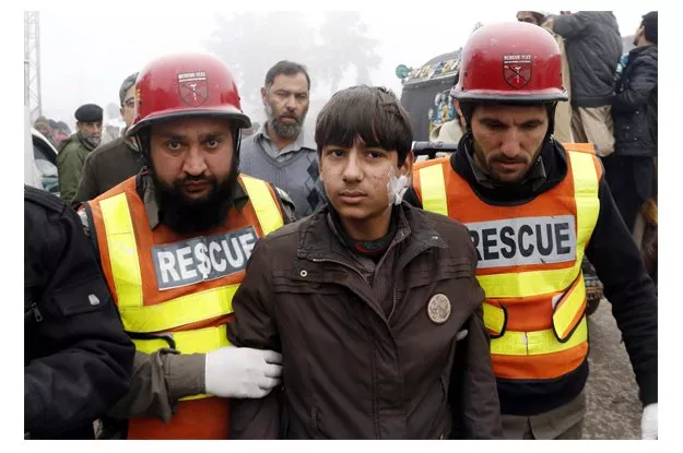 rescue officials busy in rescue operation at the site after remote control bomb explosion at chamkani vegetable market photo ppi rescue officials busy in rescue operation at the site after remote control bomb explosion at chamkani vegetable market photo ppi