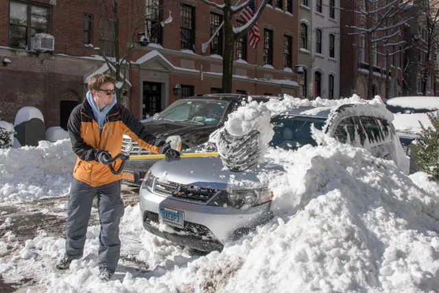 a man clears his car with a shovel near central park on january 24 2016 in new york photo afp a man clears his car with a shovel near central park on january 24 2016 in new york photo afp